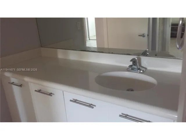 a bathroom with a toilet and a bathtub