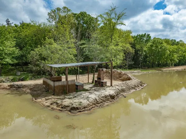 a view of a house with a backyard of a house