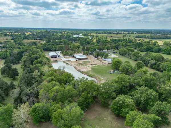 a view of a swimming pool with a yard