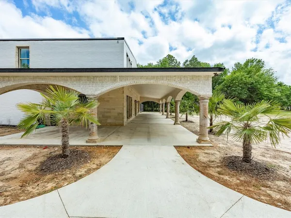 a view of a swimming pool with a patio