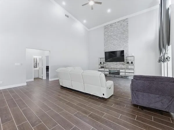 a view of a dining room with furniture and a chandelier