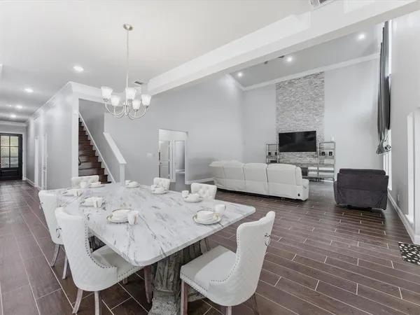 a large kitchen with a table and chairs