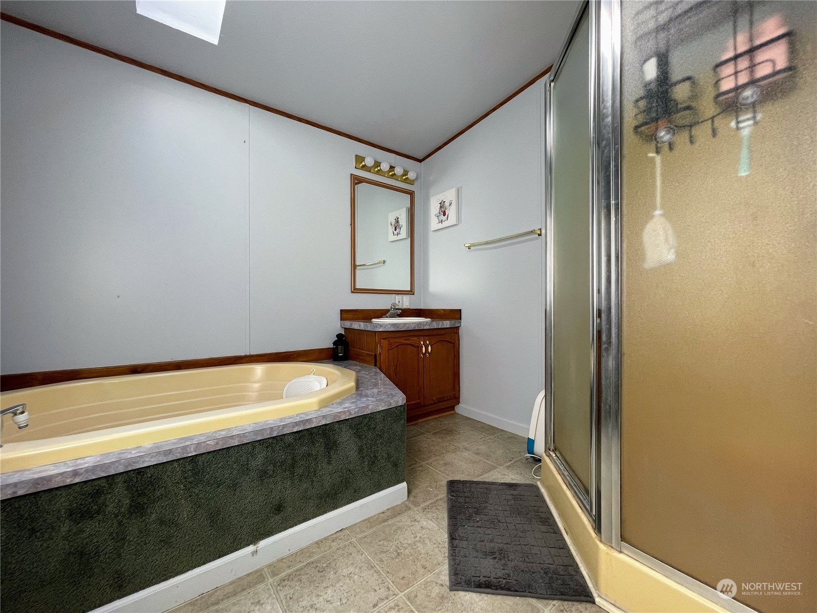 17902 Michelles Lane Southwest Rochester, WA 98579 - Photo 13 of 25 a bathroom with a tub and a shower