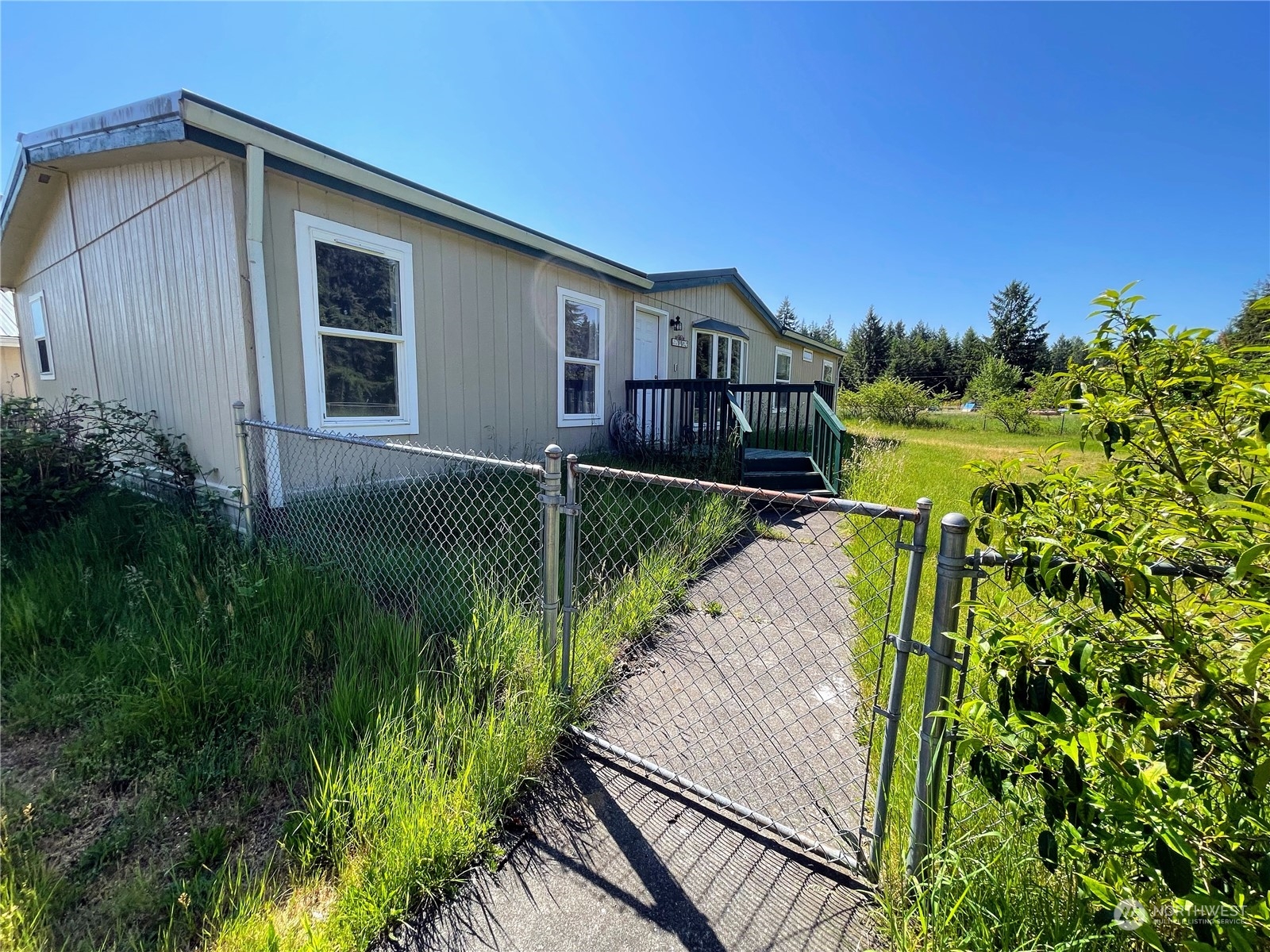 17902 Michelles Lane Southwest Rochester, WA 98579 - Photo 2 of 25 a house view with a garden space