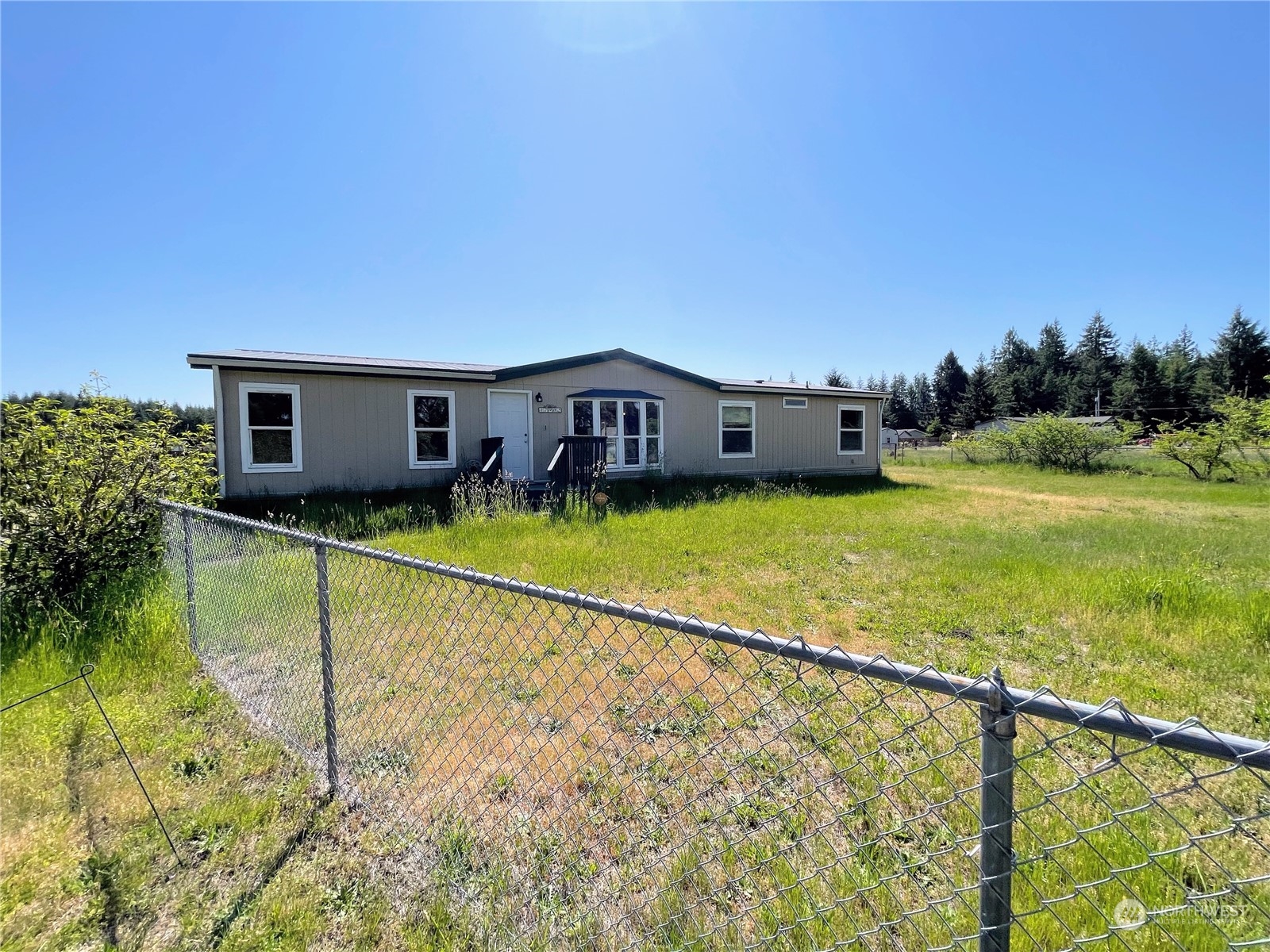 17902 Michelles Lane Southwest Rochester, WA 98579 - Photo 3 of 25 a view of a house with pool and a yard