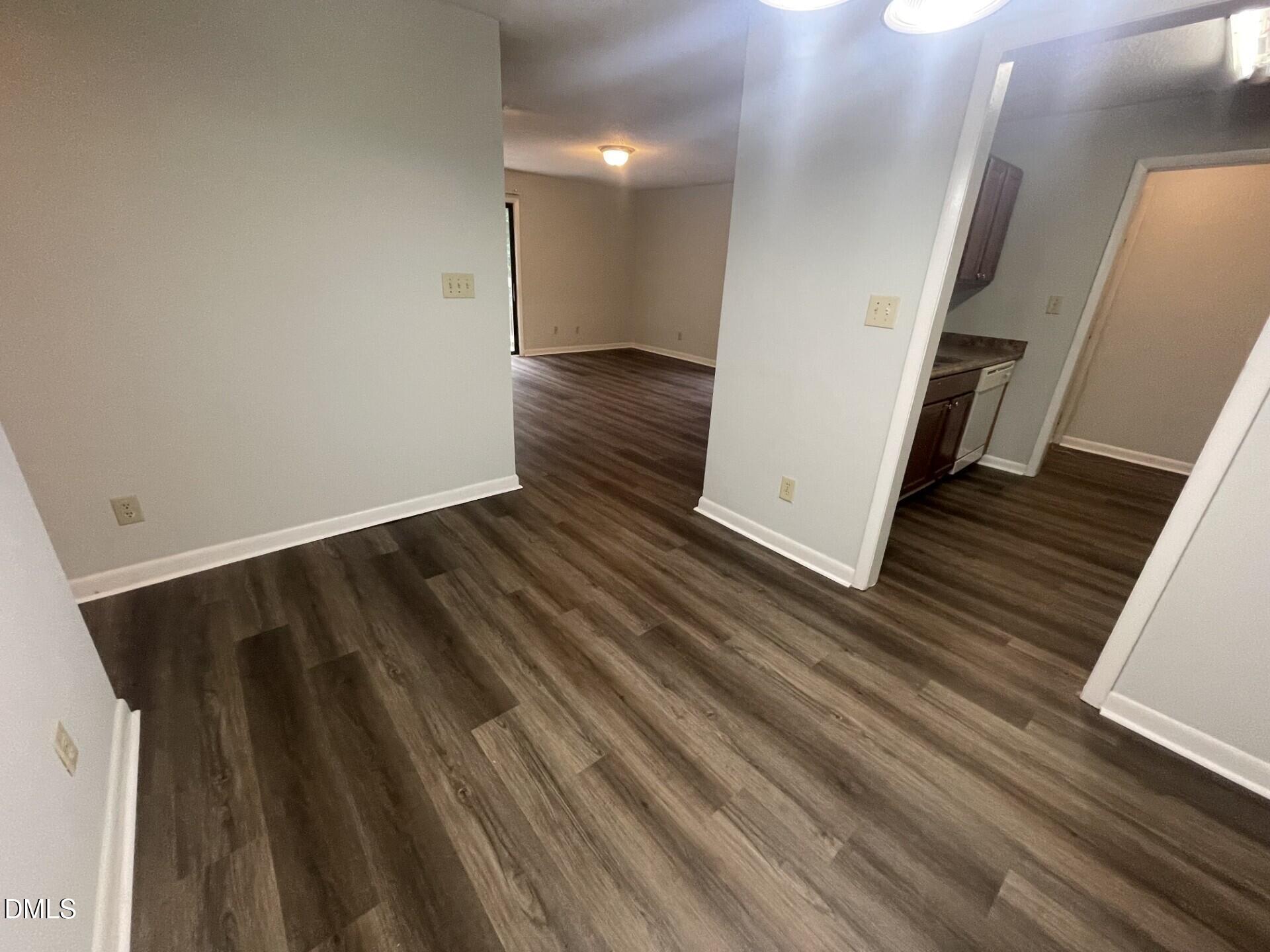 5155 Windy Hill Drive, Unit 202 Raleigh, NC 27609 - Photo 5 of 10 a view of a hallway with wooden floor