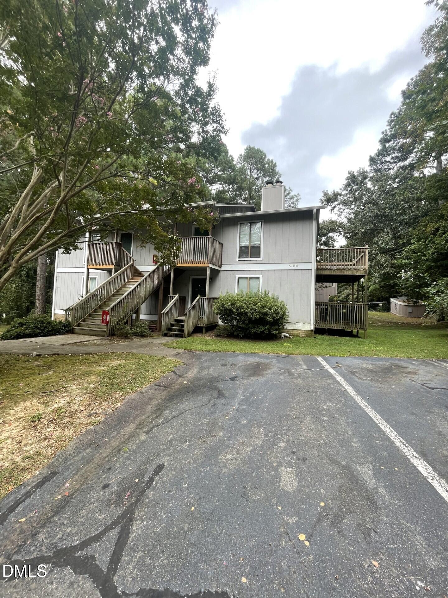 5155 Windy Hill Drive, Unit 202 Raleigh, NC 27609 - Photo 10 of 10 a front view of a house with a yard