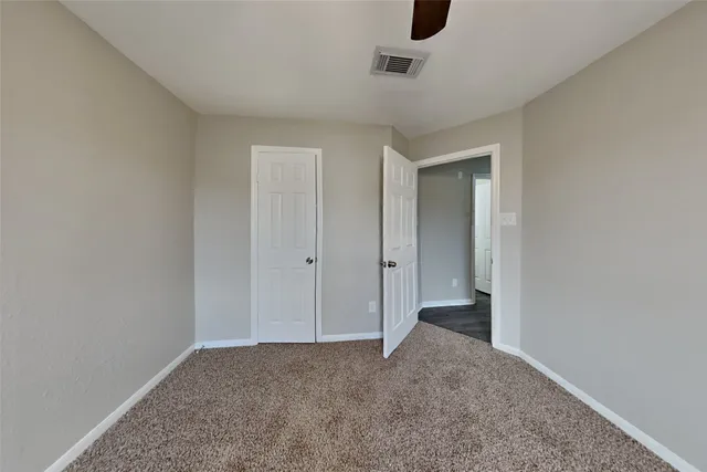 a view of an empty room and window