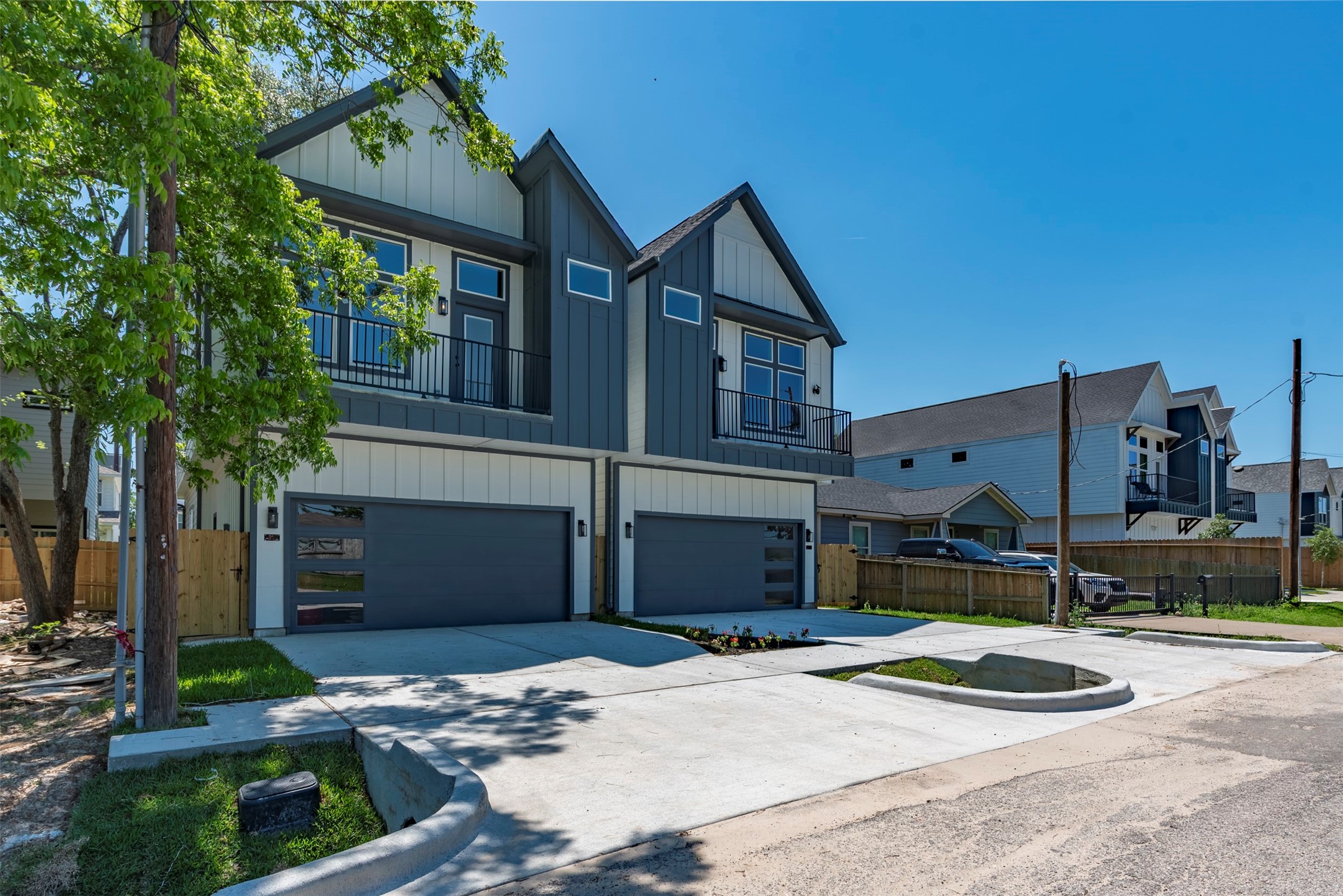 Front elevation of the homes offer symmetrical design, dual-toned siding, upper-level balconies, and a contemporary finish.