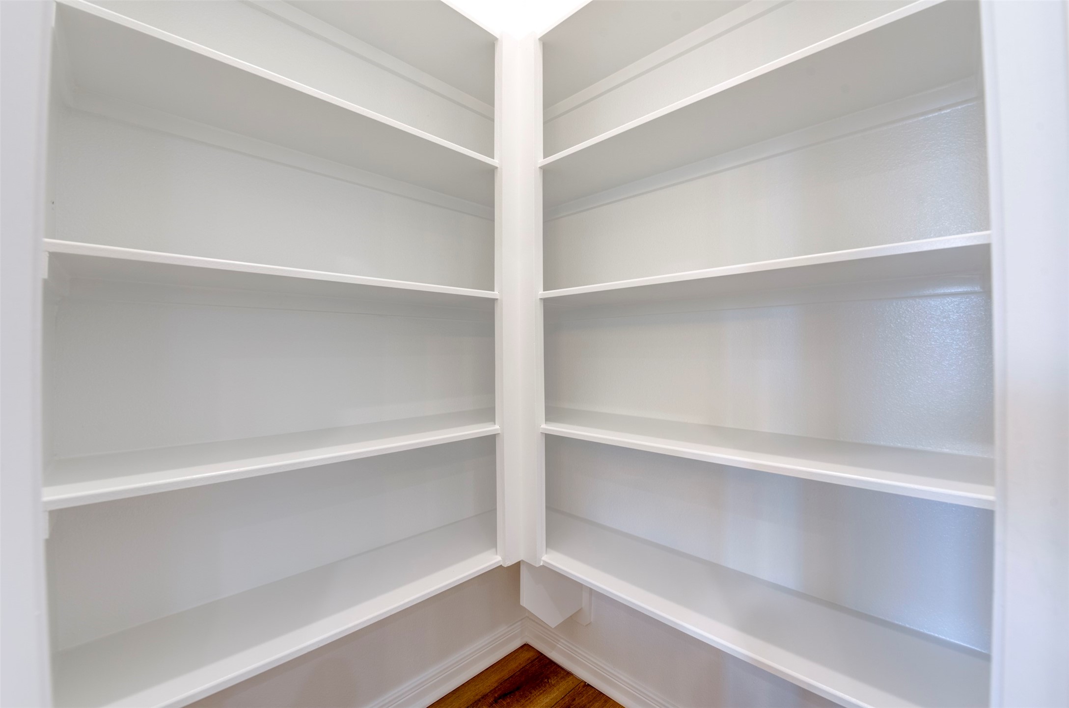 6807 Paris Street Houston, TX 77021 - Photo 13 of 37 Spacious walk-in pantry with built-in shelving, offering ample storage and easy organization for everyday living.