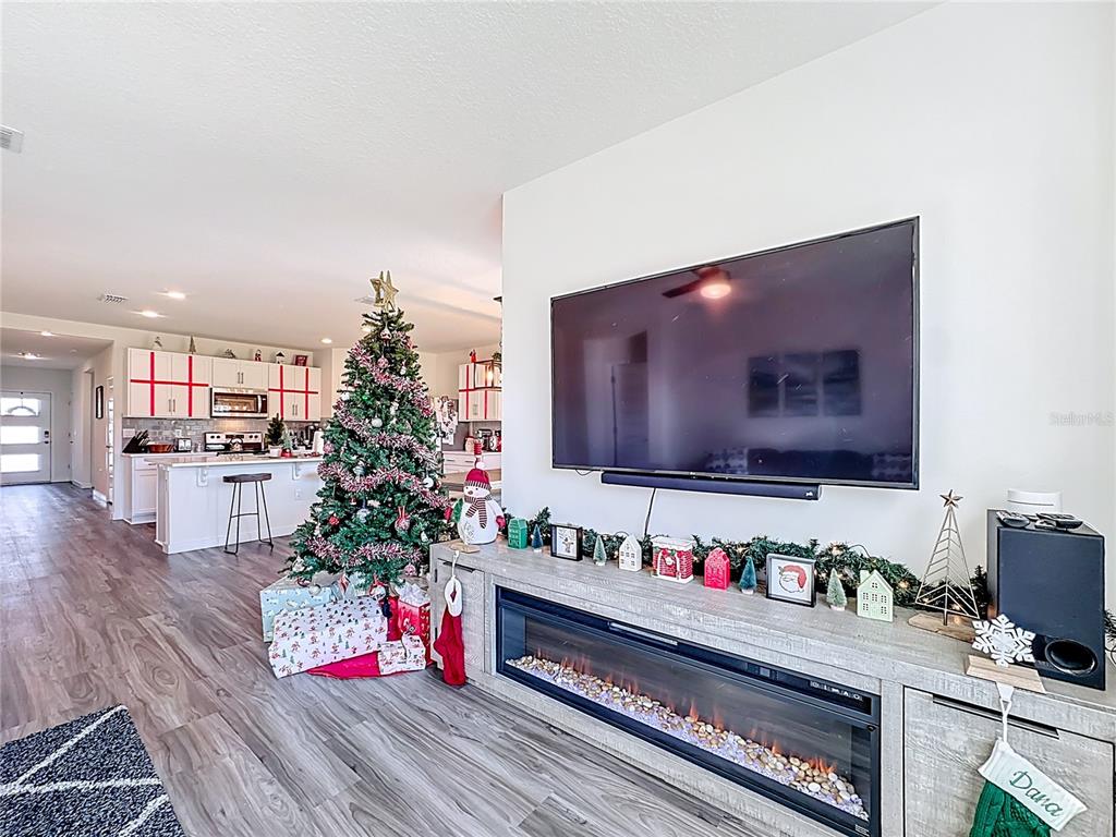 348 Talisi Loop St. Cloud, FL 34771 - Photo 16 of 35 a living room with furniture and flowers
