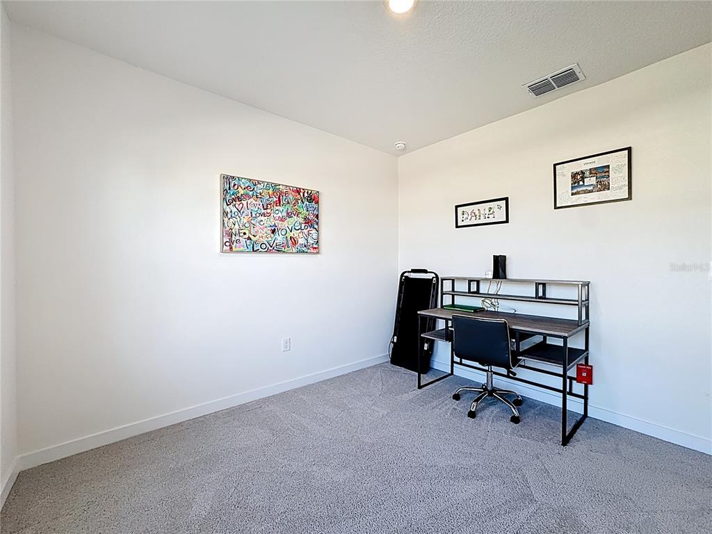 348 Talisi Loop St. Cloud, FL 34771 - Photo 17 of 35 a view of workspace with lounge chair