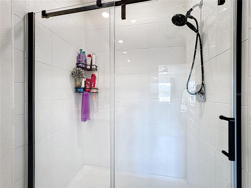 348 Talisi Loop St. Cloud, FL 34771 - Photo 28 of 35 a bathroom with a shower