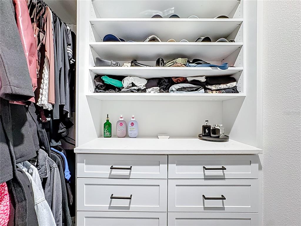 348 Talisi Loop St. Cloud, FL 34771 - Photo 31 of 35 a view of white cabinets with wooden floor