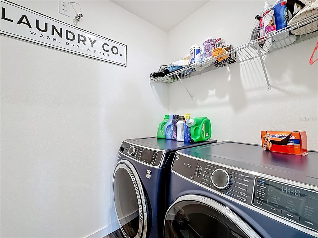 348 Talisi Loop St. Cloud, FL 34771 - Photo 32 of 35 a utility room with dryer and washer