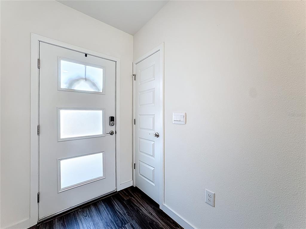 348 Talisi Loop St. Cloud, FL 34771 - Photo 4 of 35 a view of room with window and wooden floor