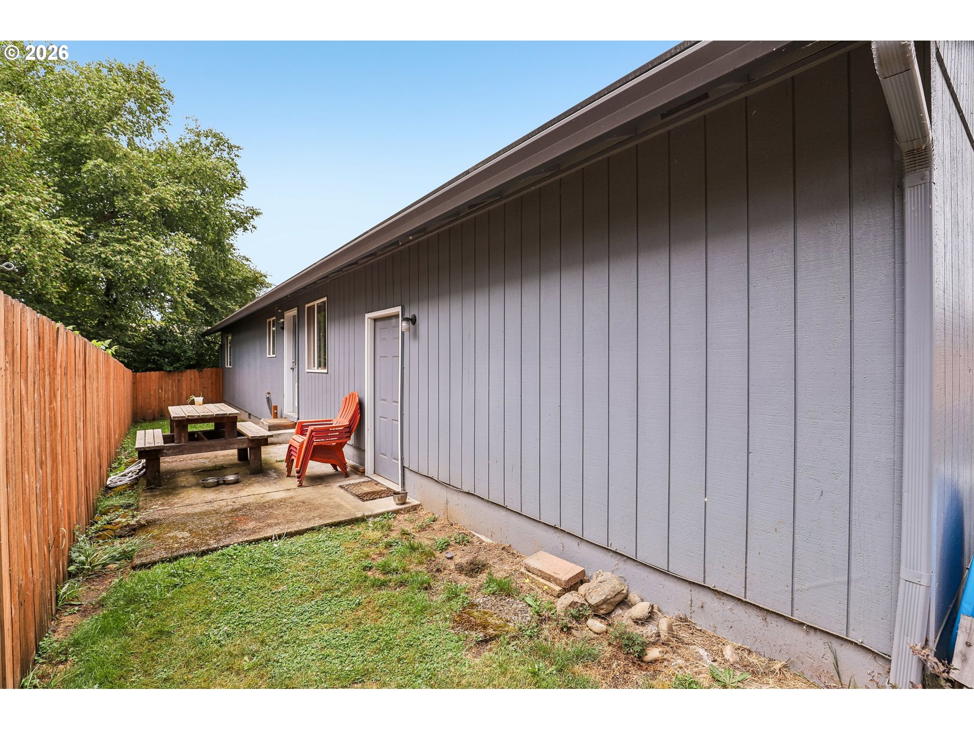 608 Southeast Sumner Street Camas, WA 98607 - Photo 25 of 39 a backyard of a house with table and chairs