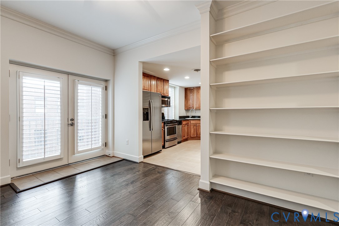 413 Stuart Circle, Unit 3D Richmond, VA 23220 - Photo 12 of 26 a view of a kitchen with wooden floor and a window