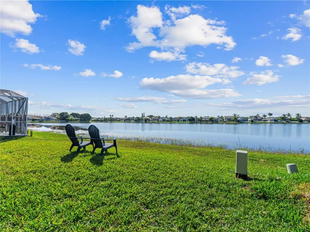 a view of a lake with a yard