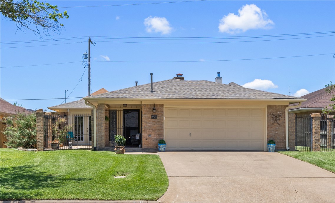 2911 Braeburn Street Bryan, TX 77802 - Photo 3 of 30 Nice Covered Entry and Front Patio Area. 2 Car Garage with New Garage Door Opener and Key Pad.