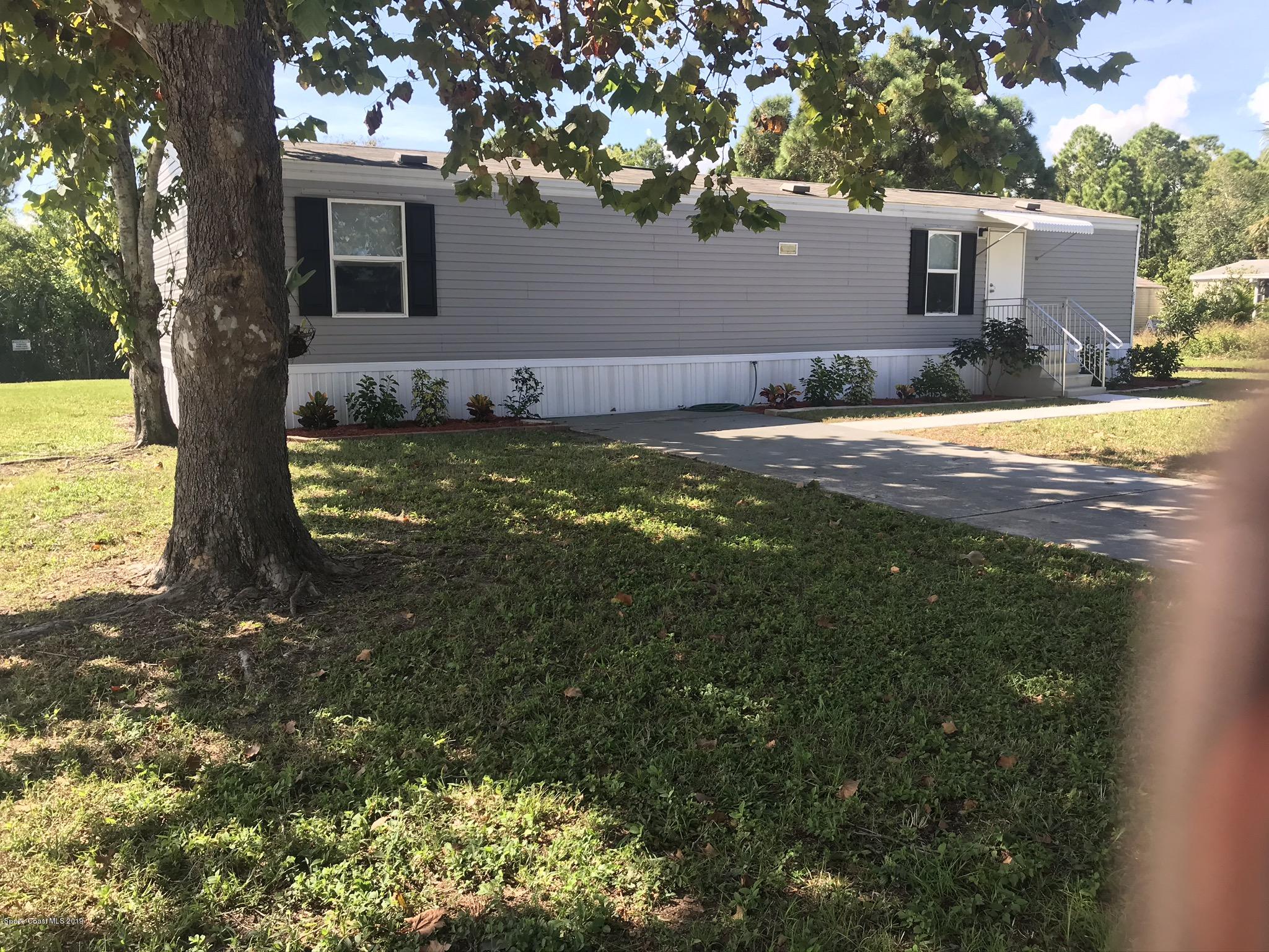 535 Baker Road Merritt Island, FL 32953 - Photo 1 of 34 a view of a house with a yard