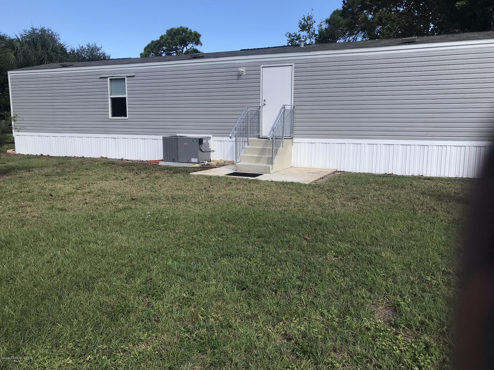 535 Baker Road Merritt Island, FL 32953 - Photo 22 of 34 a view of a backyard