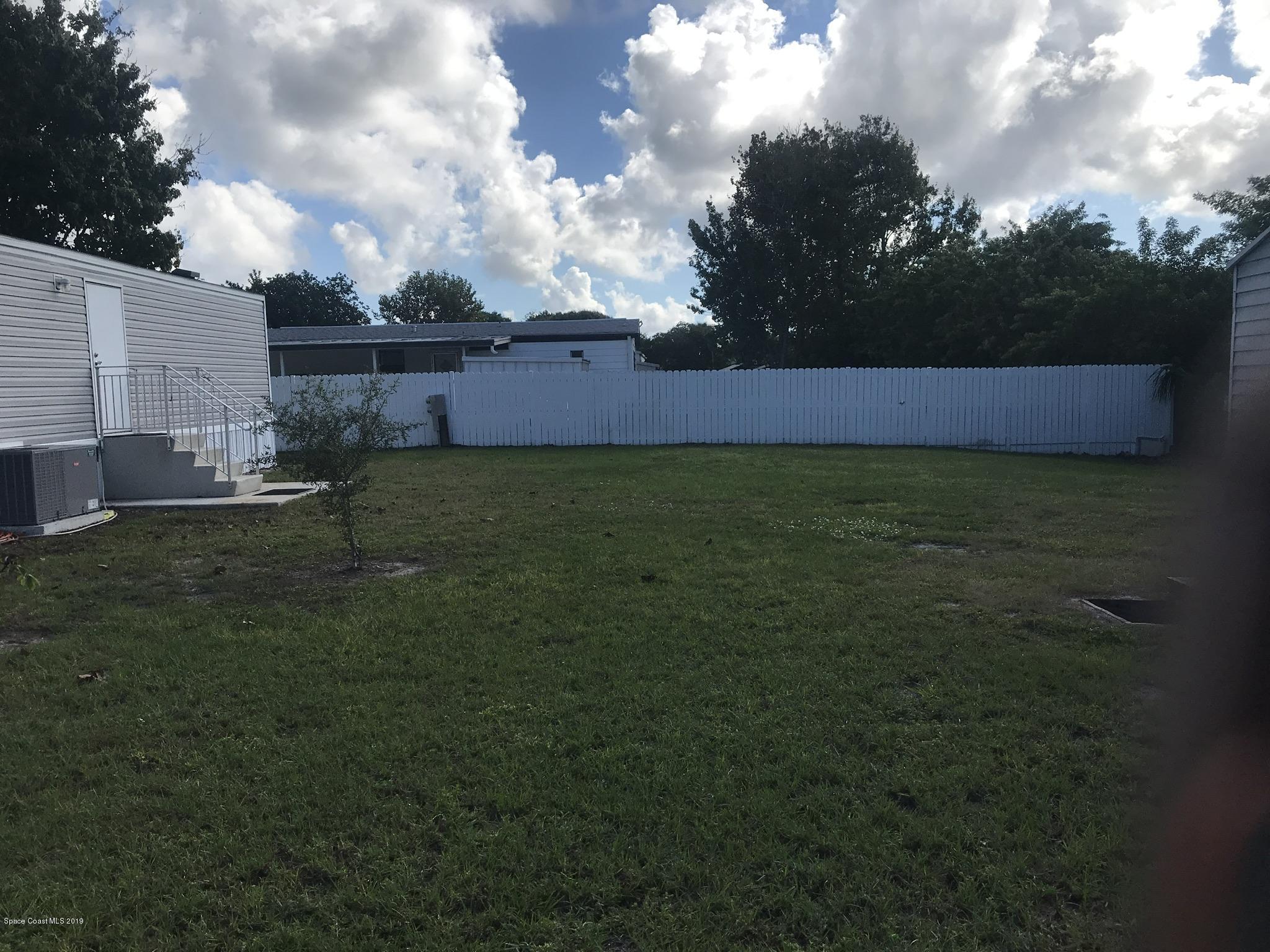 535 Baker Road Merritt Island, FL 32953 - Photo 27 of 34 a view of an outdoor space and a yard