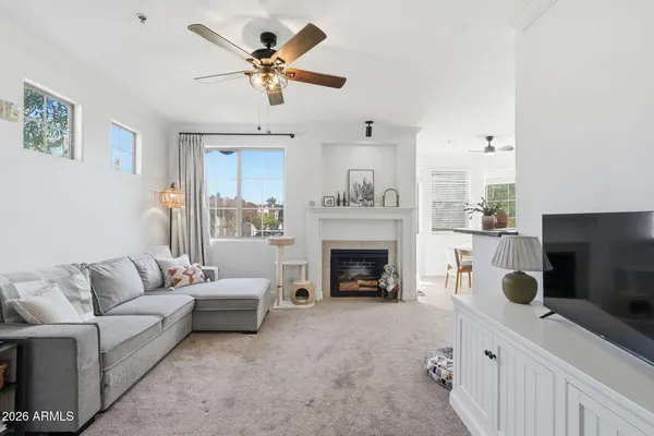 a living room with furniture and a fireplace