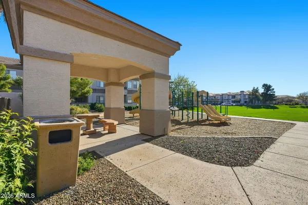 a view of a house with potted plants