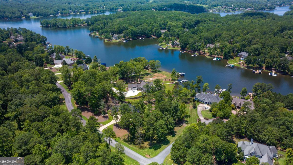 1311 Lighthouse Circle Greensboro, GA 30642 - Photo 11 of 26 an aerial view of lake residential house with outdoor space and trees all around