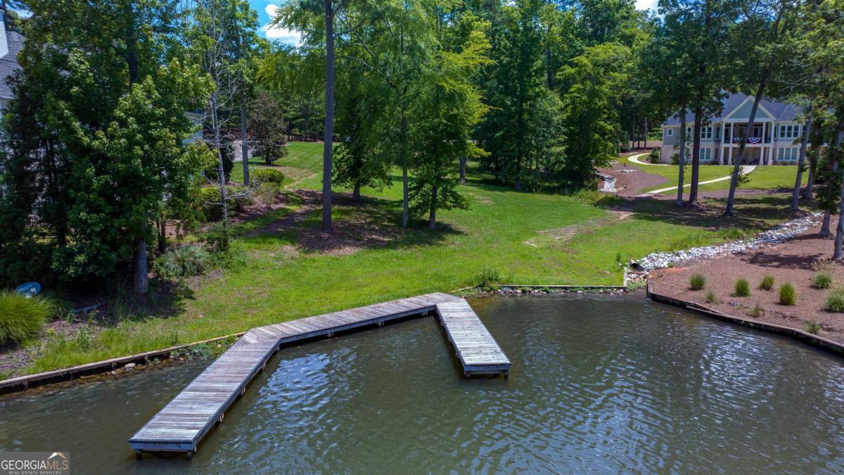 1311 Lighthouse Circle Greensboro, GA 30642 - Photo 4 of 26 a view of a lake with a yard