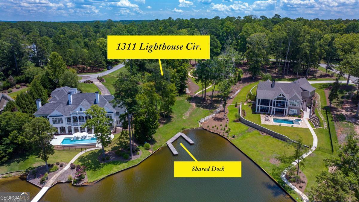 1311 Lighthouse Circle Greensboro, GA 30642 - Photo 6 of 26 an aerial view of a swimming pool with outdoor seating