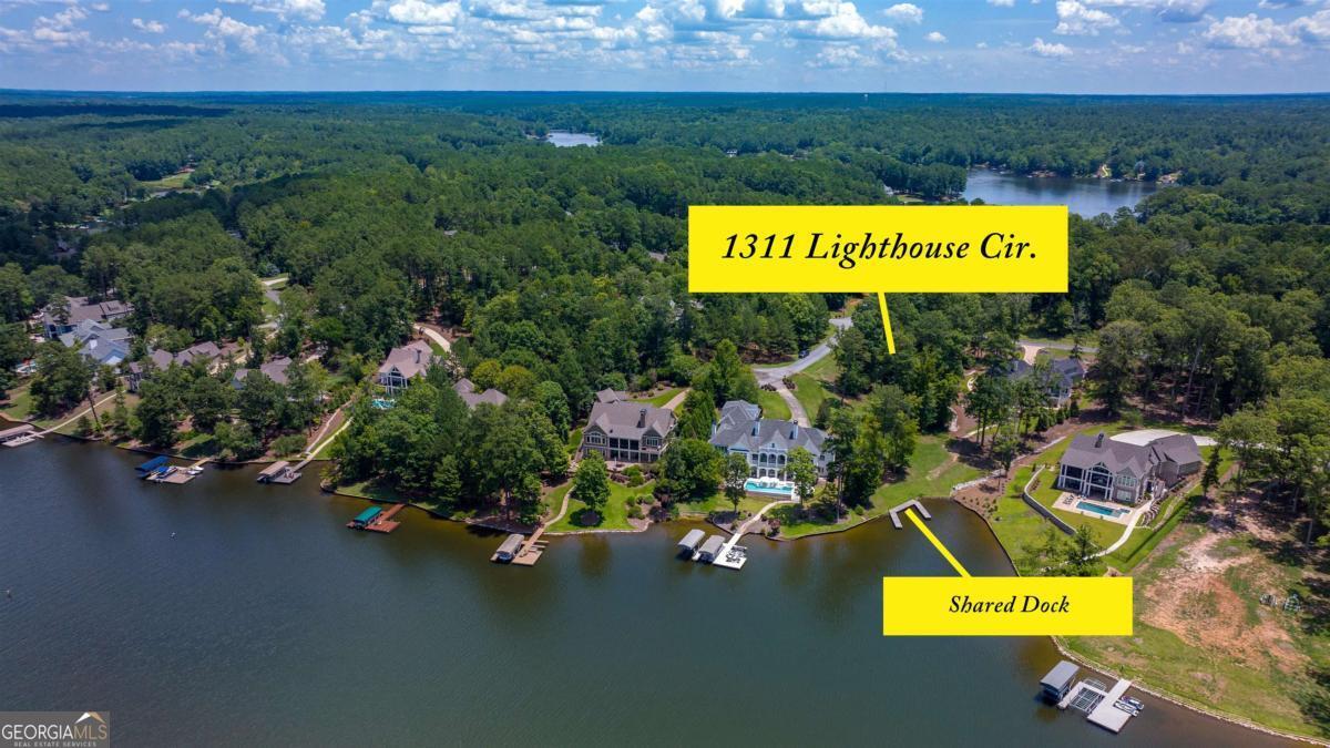 1311 Lighthouse Circle Greensboro, GA 30642 - Photo 9 of 26 a sign that is sitting on a wooden floor