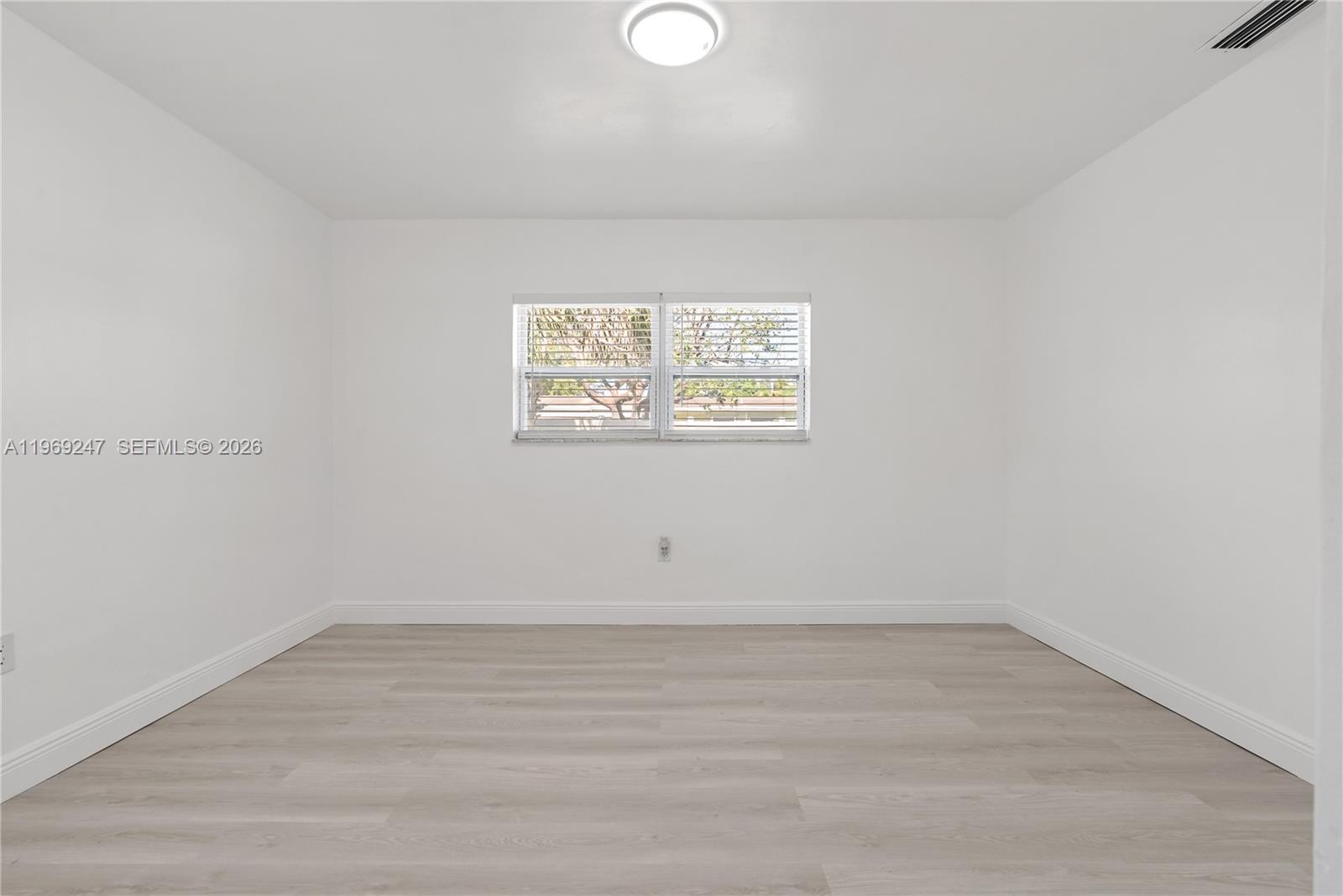3341 Northwest 7th Street Lauderhill, FL 33311 - Photo 14 of 21 wooden floor in an empty room