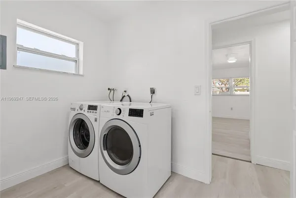 a utility room with dryer and washer