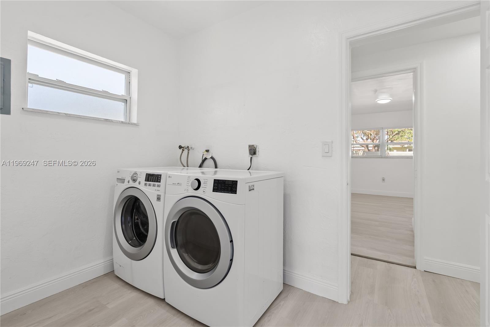 3341 Northwest 7th Street Lauderhill, FL 33311 - Photo 16 of 21 a utility room with dryer and washer