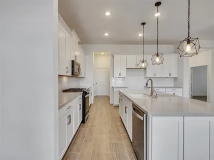 a view of a kitchen with a sink and dishwasher kitchen view