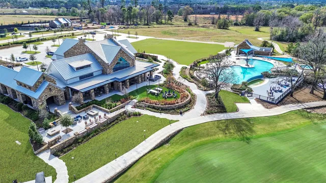 a view of a swimming pool with outdoor seating and yard