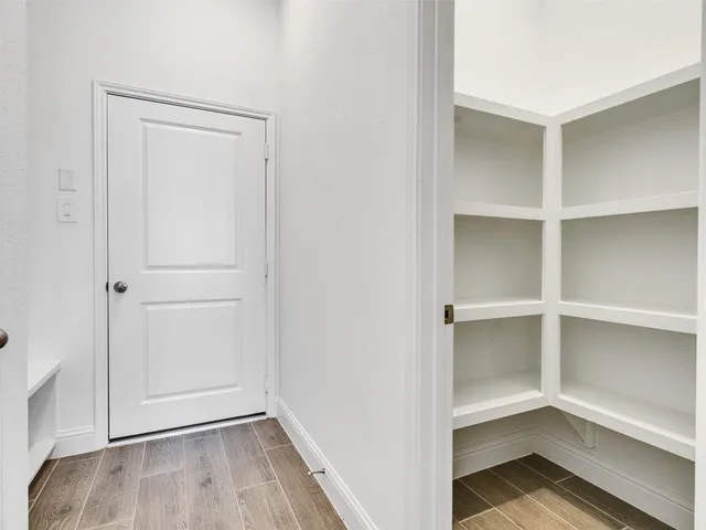 a view of an empty walk in closet