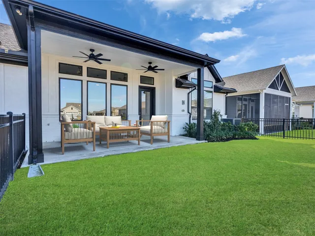 a patio with yard table and chairs