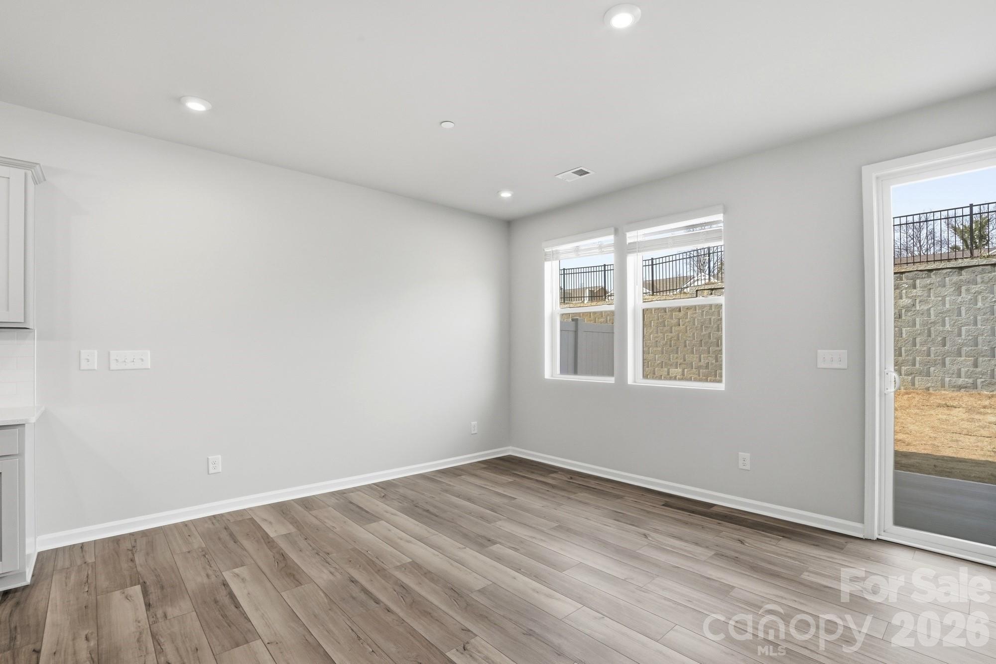 2540 Hedgecliff Road Kannapolis, NC 28083 - Photo 11 of 22 a view of empty room with wooden floor and fan