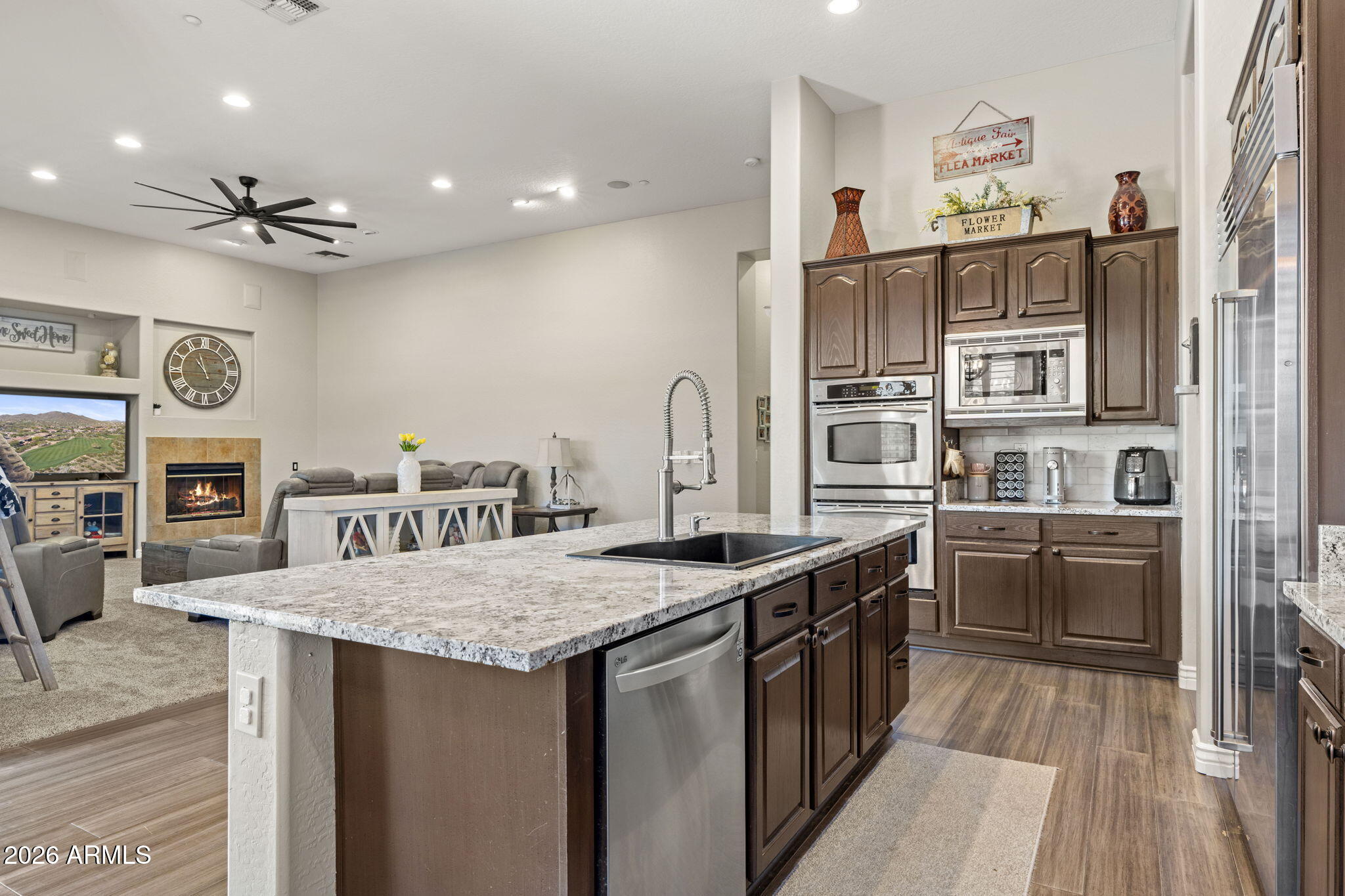 41619 North River Bend Road Anthem, AZ 85086 - Photo 52 of 84 a kitchen with stainless steel appliances granite countertop a sink and stove