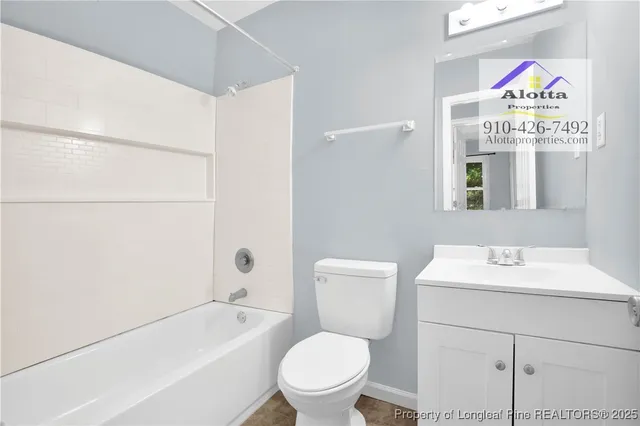 a bathroom with a toilet a sink and a bathtub