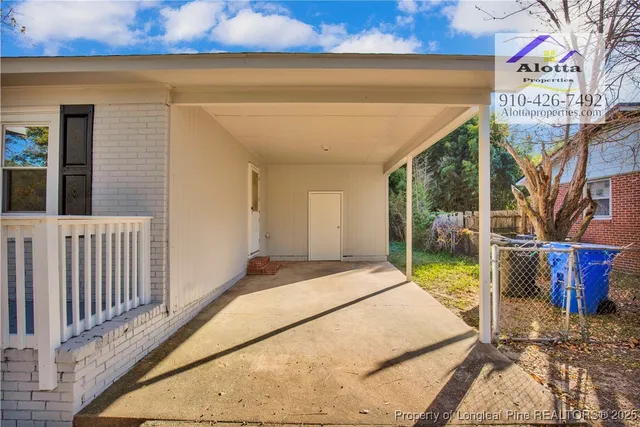 a bedroom with a bed and a table