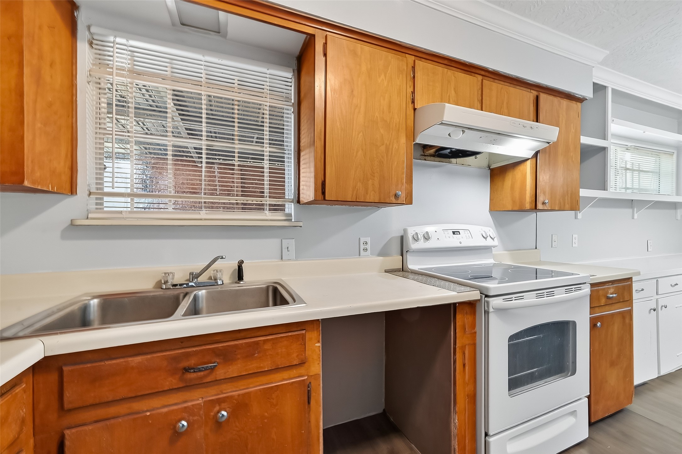 6112 Pineway Boulevard Houston, TX 77023 - Photo 12 of 21 a kitchen with a sink cabinets and a window