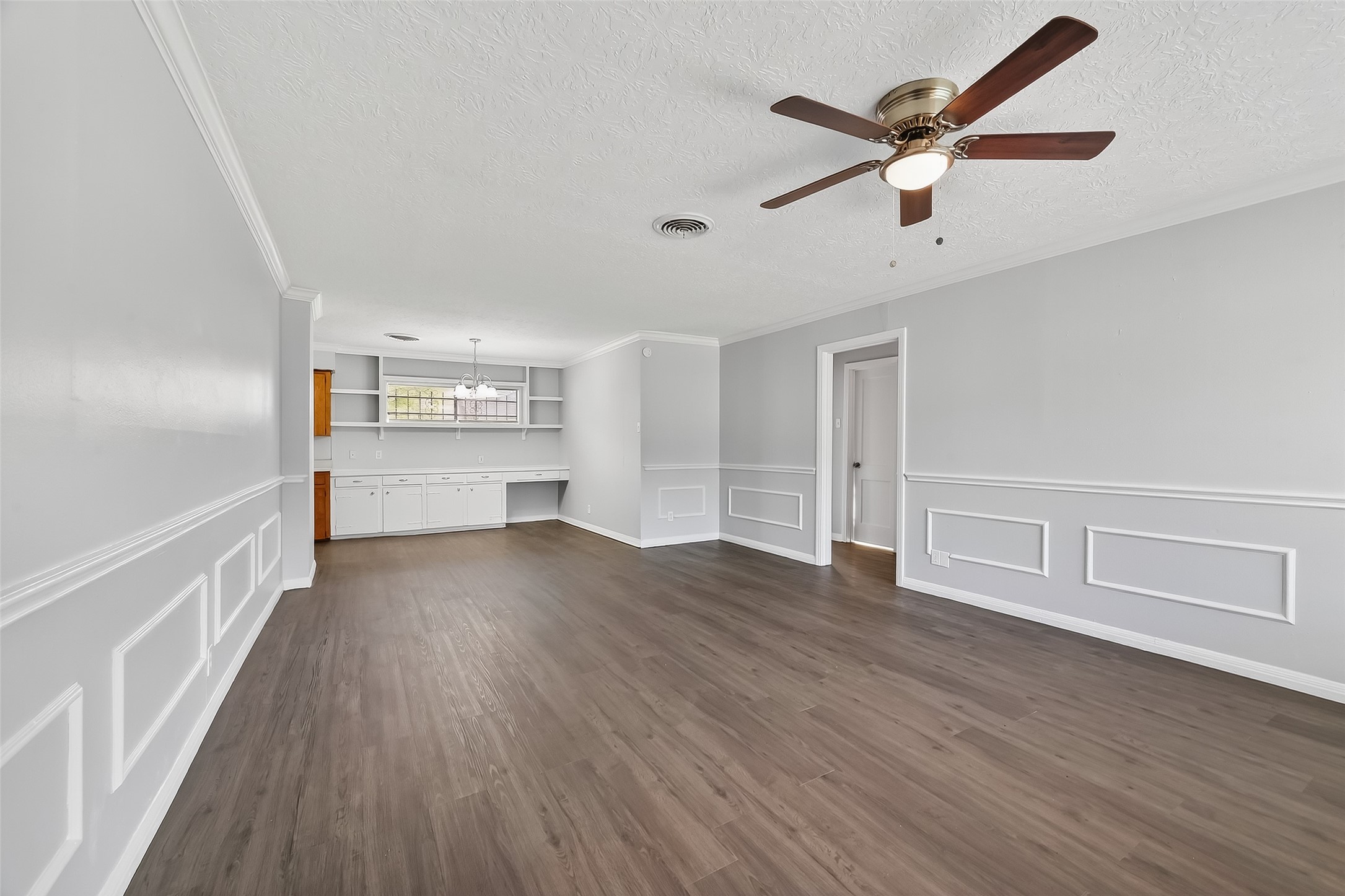 6112 Pineway Boulevard Houston, TX 77023 - Photo 4 of 21 wooden floor in an empty room with a window
