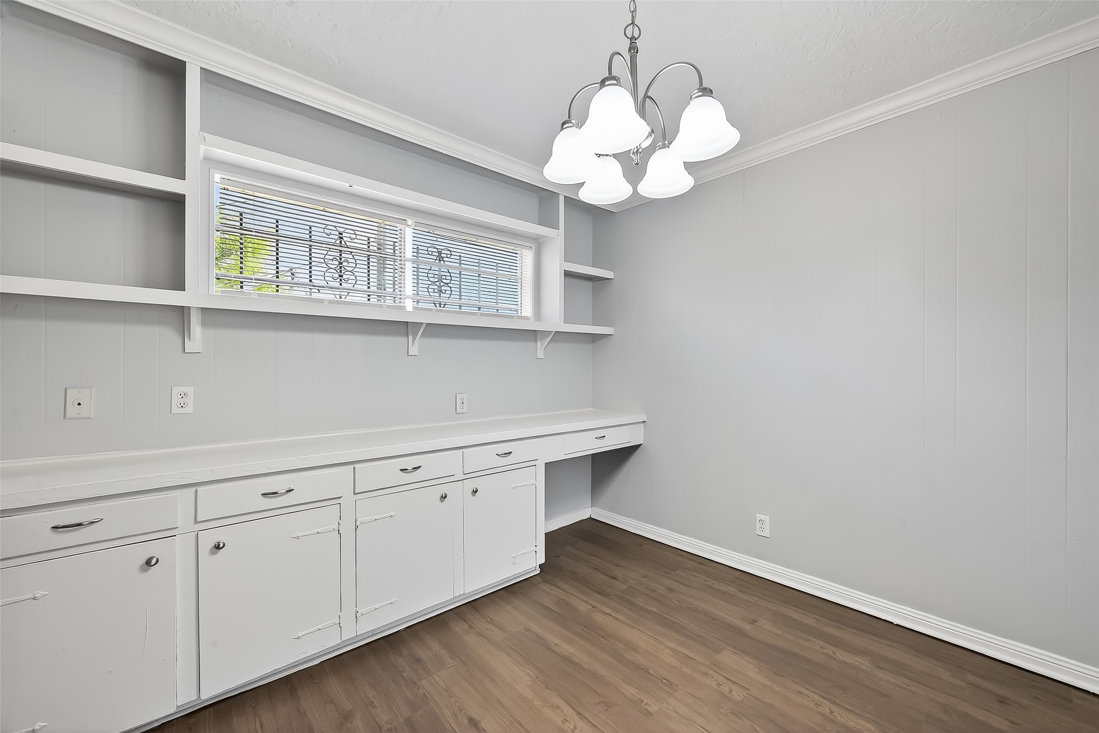6112 Pineway Boulevard Houston, TX 77023 - Photo 9 of 21 a view of a kitchen with a dishwasher and a wooden floor