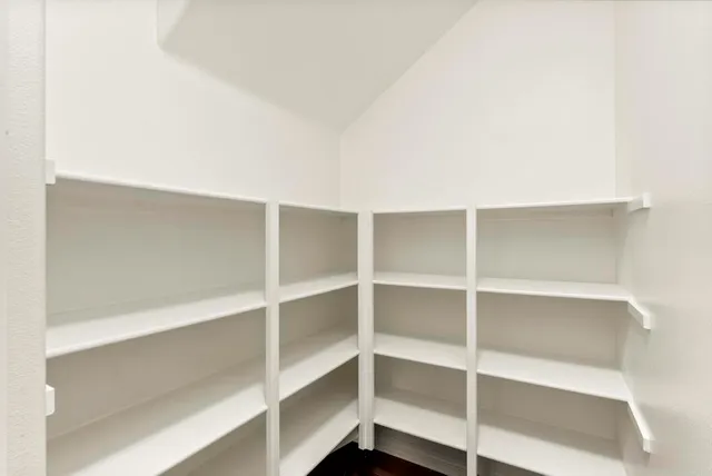 a bathroom with a sink mirror and a toilet