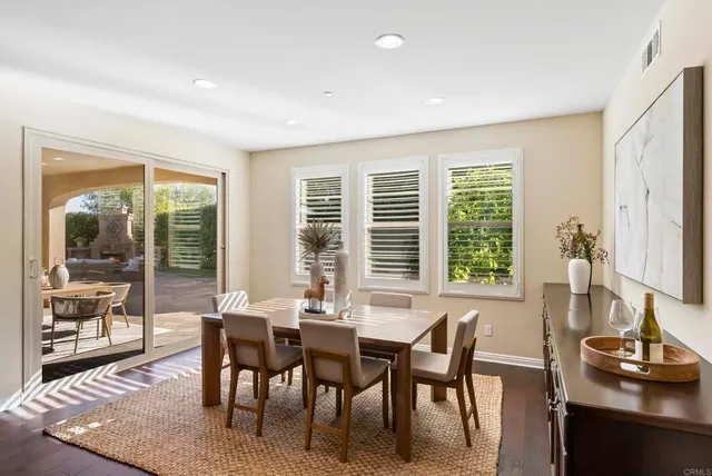 a work room with furniture and a potted plant