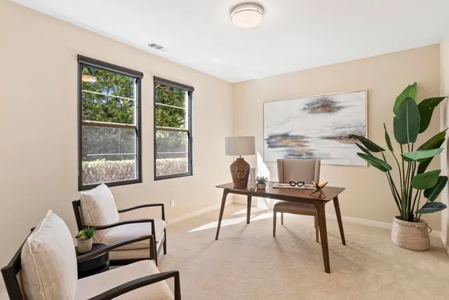 a spacious bedroom with a bed and a couch